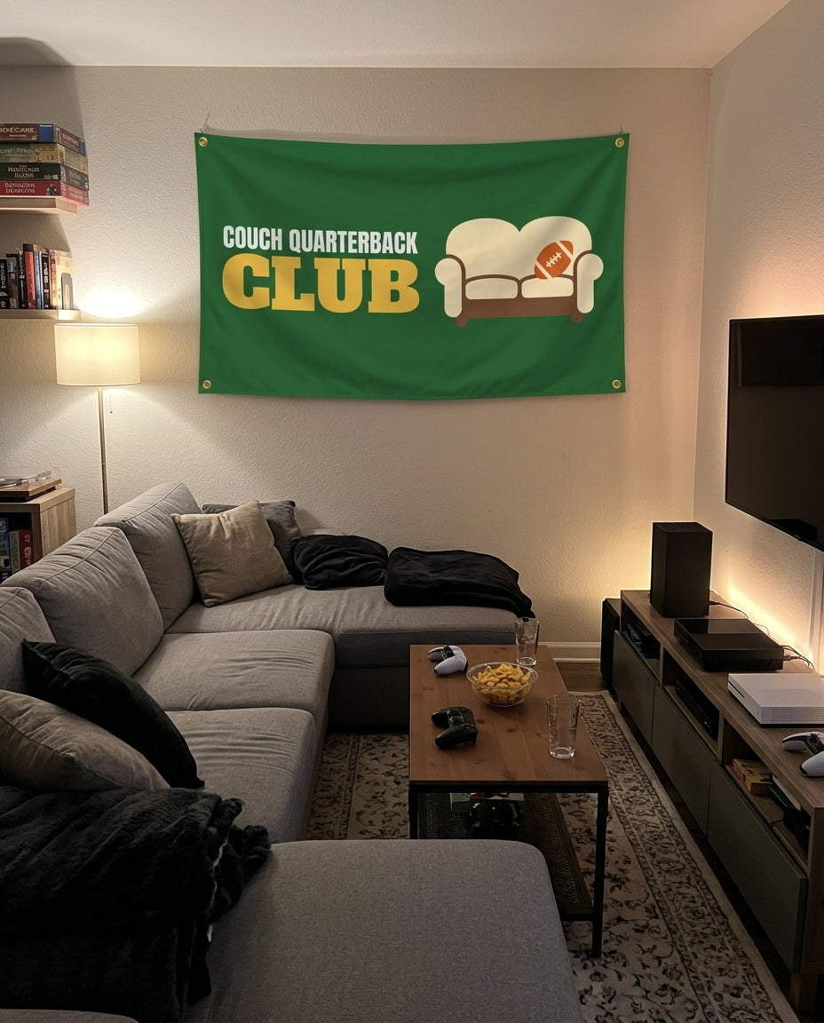 Couch Quarterback Club flag decorating a game room wall