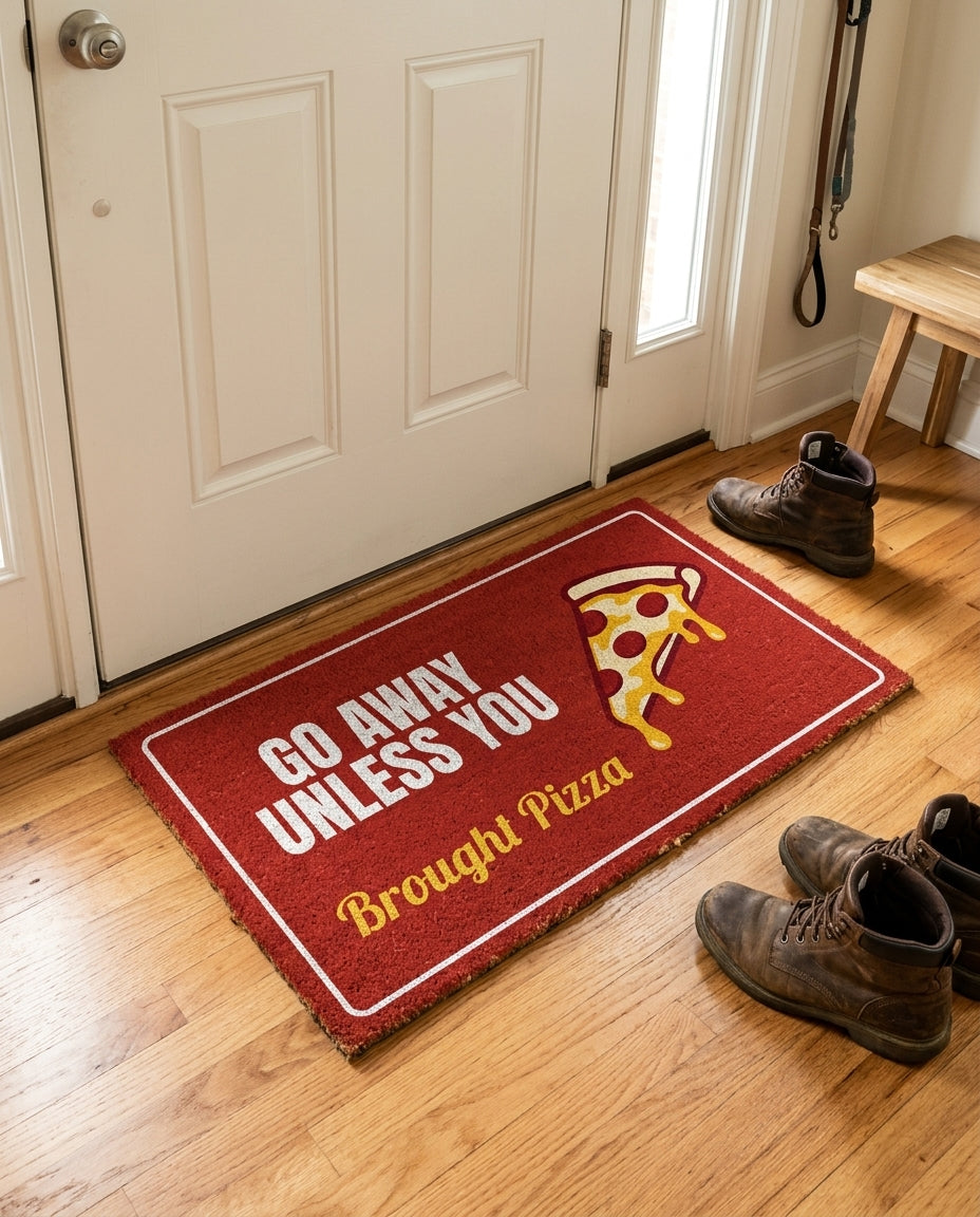 Go Away Unless You Brought Pizza welcome mat in a home entryway