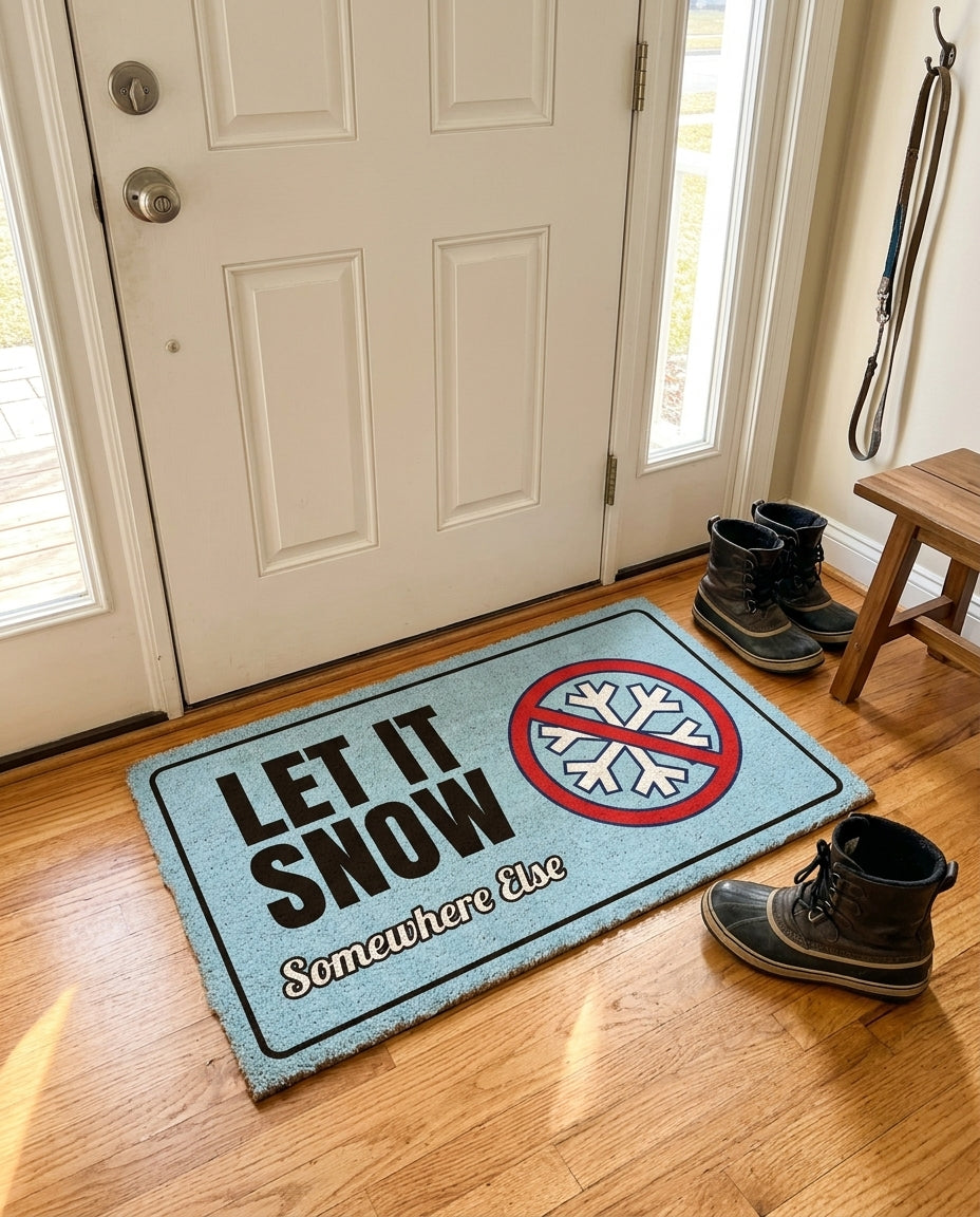 Let It Snow Somewhere Else welcome mat in a home entryway