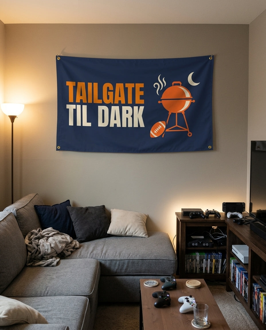Tailgate Til Dark flag decorating a game room wall