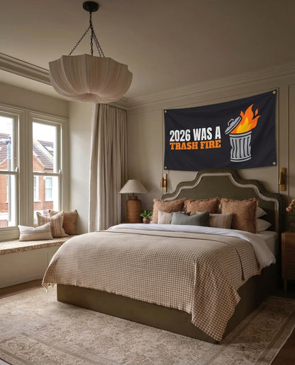 2026 Was A Trash Fire New Year's Eve wall flag hanging in a bedroom