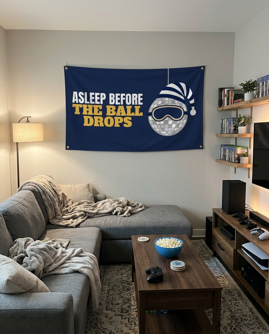 Asleep Before The Ball Drops flag decorating a game room wall
