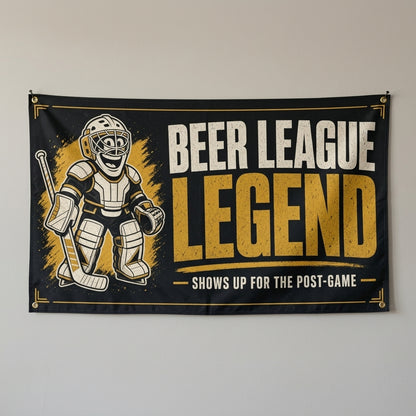 Beer League Legend hockey flag 3x5 in black and gold with a cartoon goalie, hung on a gray wall