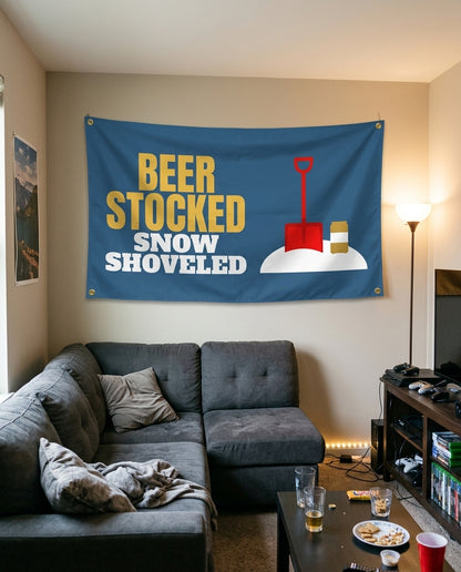 Beer Stocked Snow Shoveled flag decorating a game room wall