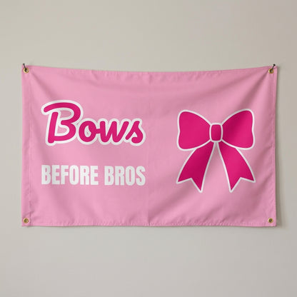 Bows Before Bros flag 3x5 in pink with a hot pink bow, hung on a wall