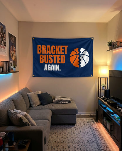 Bracket Busted Again flag decorating a game room wall