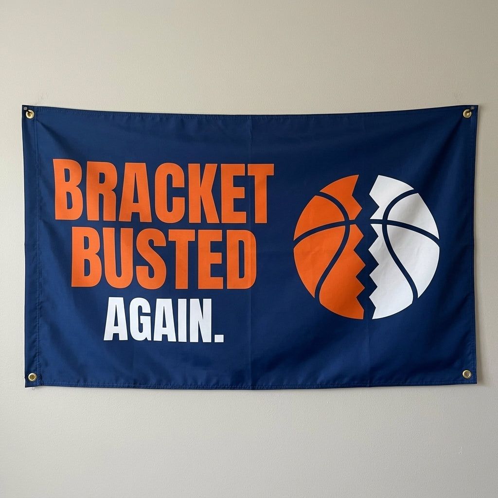 Bracket Busted Again flag 3x5 in navy and orange with a cracked basketball, hung on a wall
