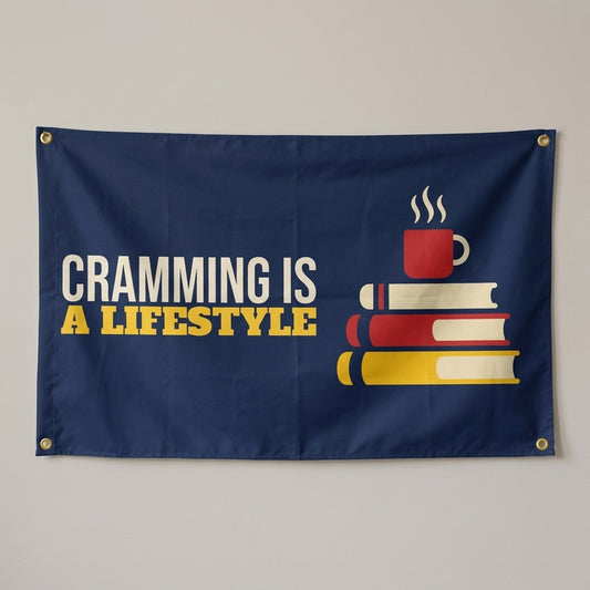Cramming Is A Lifestyle flag 3x5 in navy with a steaming mug on a stack of books, hung on a wall