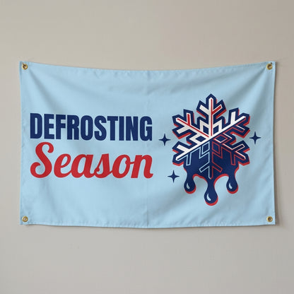 Melting Snowflake Season flag 3x5 in light blue with a melting snowflake, hung on a wall