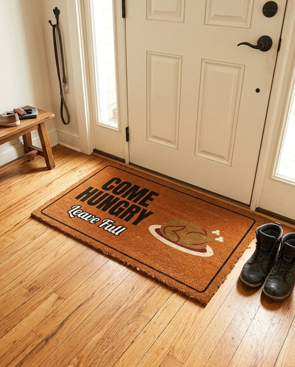 Come Hungry Leave Full welcome mat in a home entryway