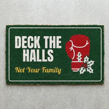 Deck The Halls Not Your Family doormat 30x18 in green with a red boxing glove and holly