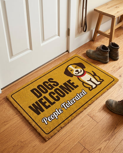 Dogs Welcome People Tolerated welcome mat in a home entryway