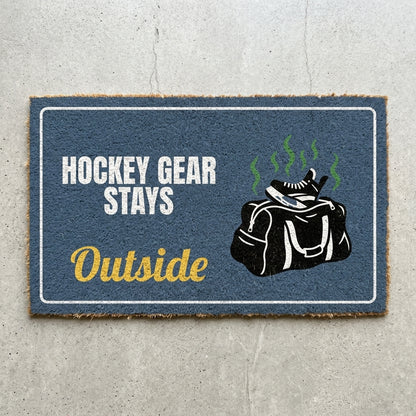 Hockey Gear Stays Outside doormat 30x18 in slate blue with a smelly hockey bag