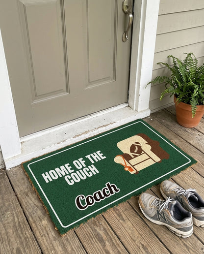 Home Of The Couch Coach funny sports doormat on a front porch
