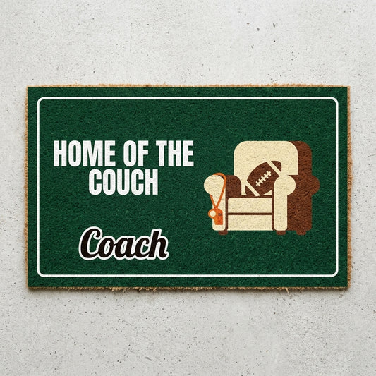 Home Of The Couch Coach doormat 30x18 in green with an armchair and a football