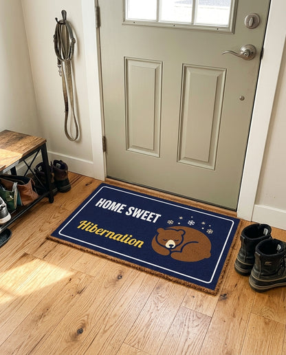 Home Sweet Hibernation welcome mat in a home entryway