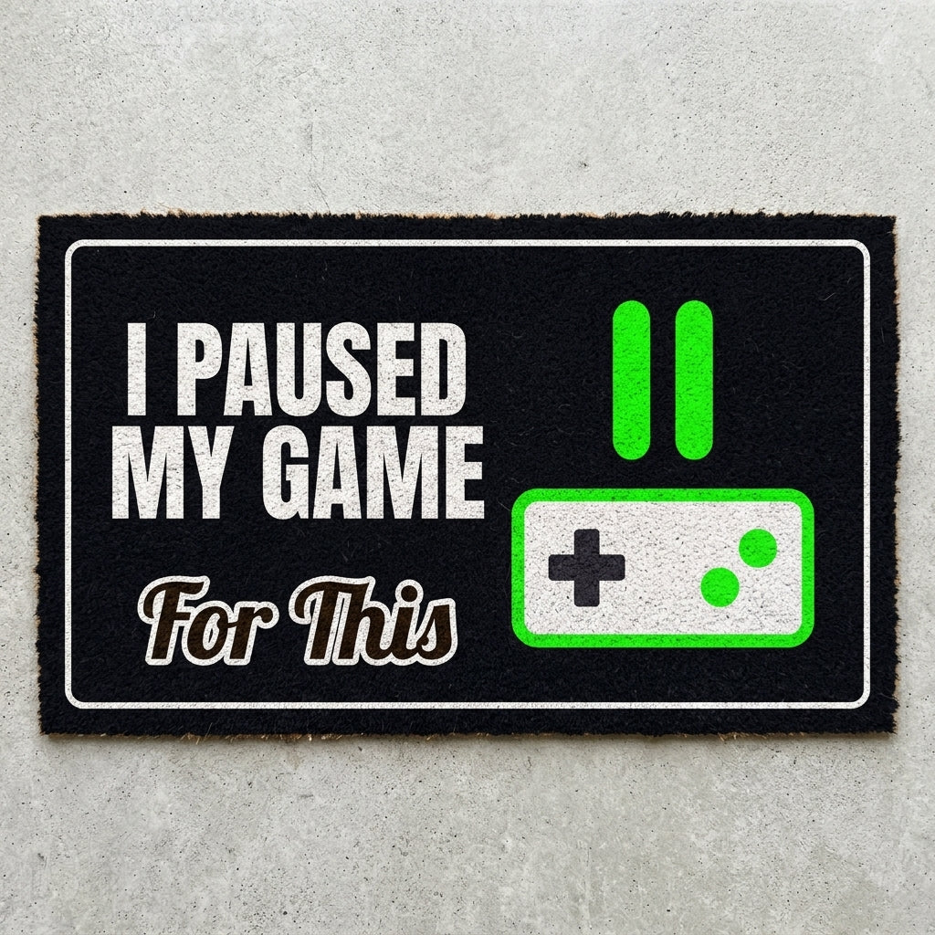 Game Paused For This doormat 30x18 in black with a pause icon