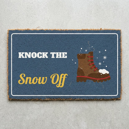 Knock The Snow Off doormat 30x18 in slate blue with a snowy boot