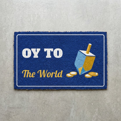 Oy To The World doormat 30x18 in royal blue with a dreidel and gold coins