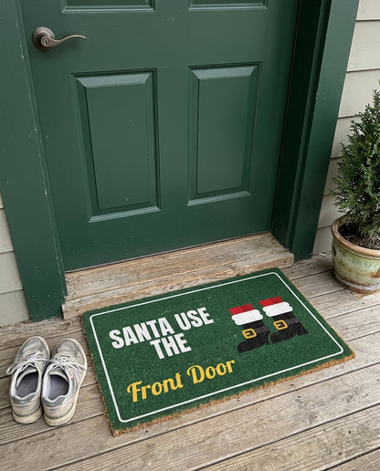 Santa Use The Front Door Christmas doormat on a front porch