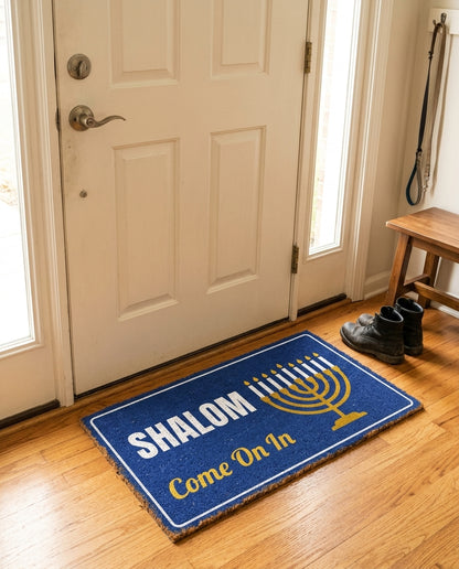 Shalom Come On In welcome mat in a home entryway