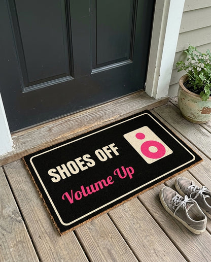 Shoes Off Volume Up music doormat on a front porch