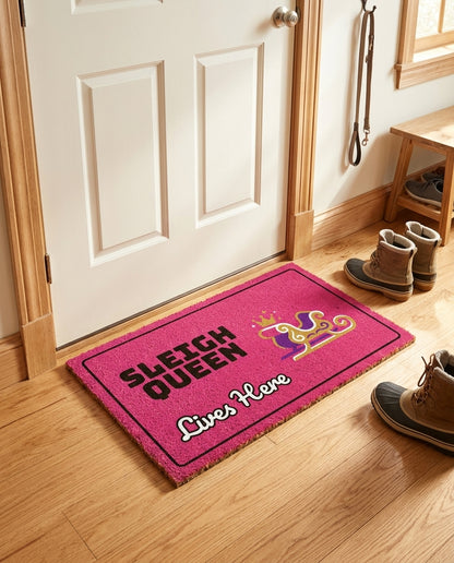 Sleigh Queen Lives Here welcome mat in a home entryway