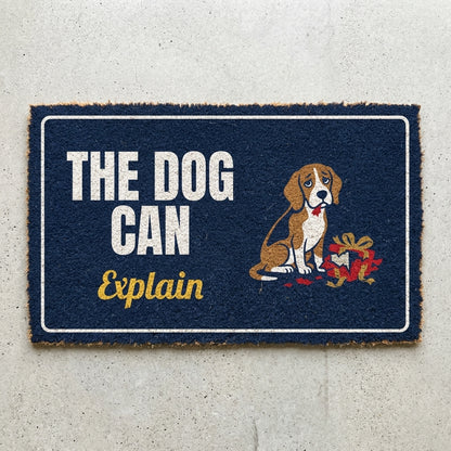 The Dog Can Explain doormat 30x18 in navy with a guilty beagle and a torn gift
