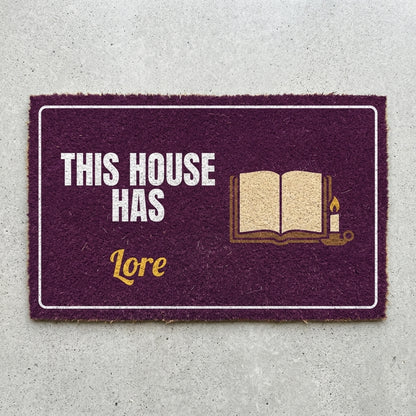 This House Has Lore doormat 30x18 in plum with an old book and a candle
