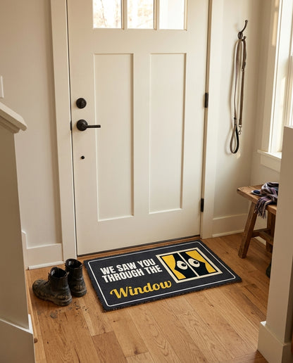 We Saw You Through The Window welcome mat in a home entryway