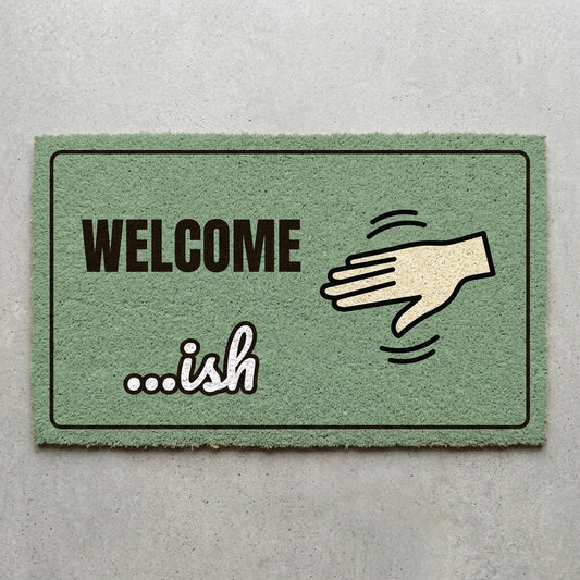 Welcome Ish doormat 30x18 in sage green with a waving hand