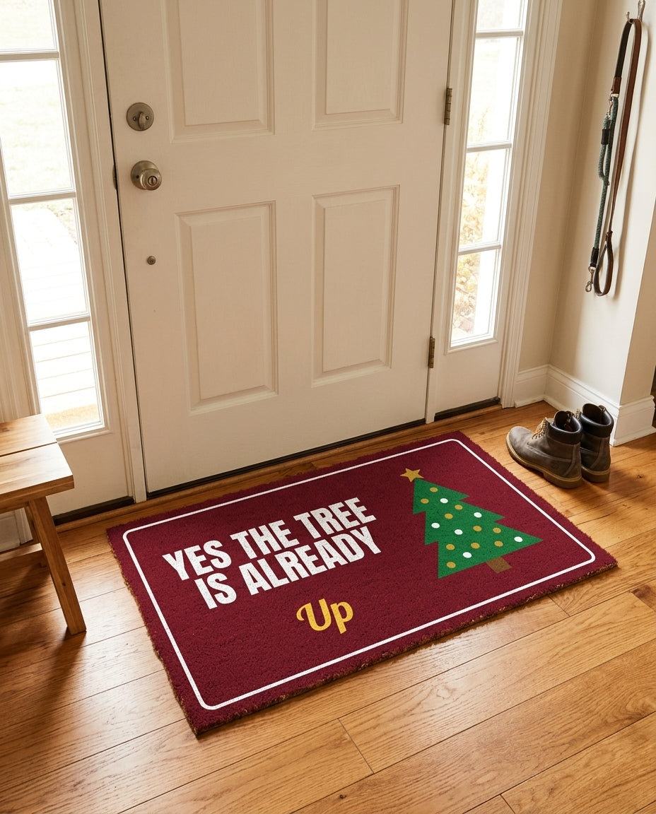 Yes The Tree Is Already Up welcome mat in a home entryway
