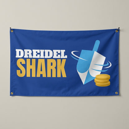 Dreidel Shark flag 3x5 in royal blue with a spinning dreidel and gold coins, hung on a wall