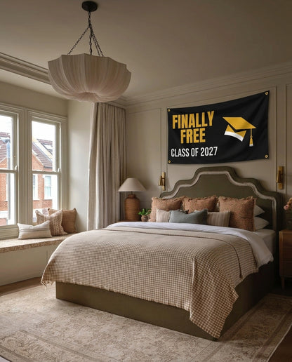 Finally Free Class Of 2027 graduation wall flag hanging in a bedroom