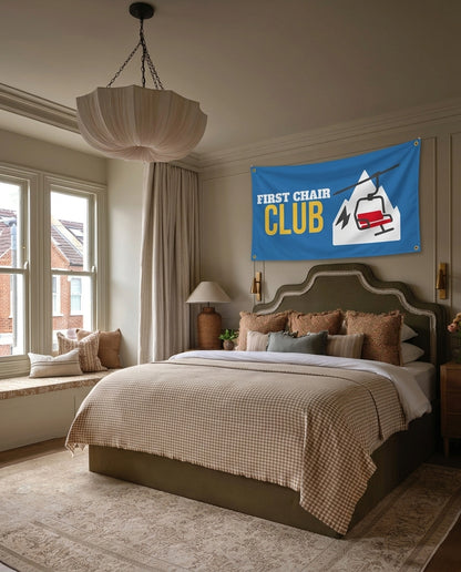 First Chair Club ski lodge wall flag hanging in a bedroom