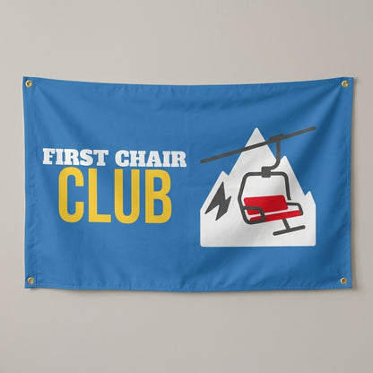 First Chair Club flag 3x5 in blue with a red chairlift and a mountain, hung on a wall