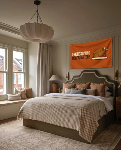 Friendsgiving Headquarters Thanksgiving wall flag hanging in a bedroom