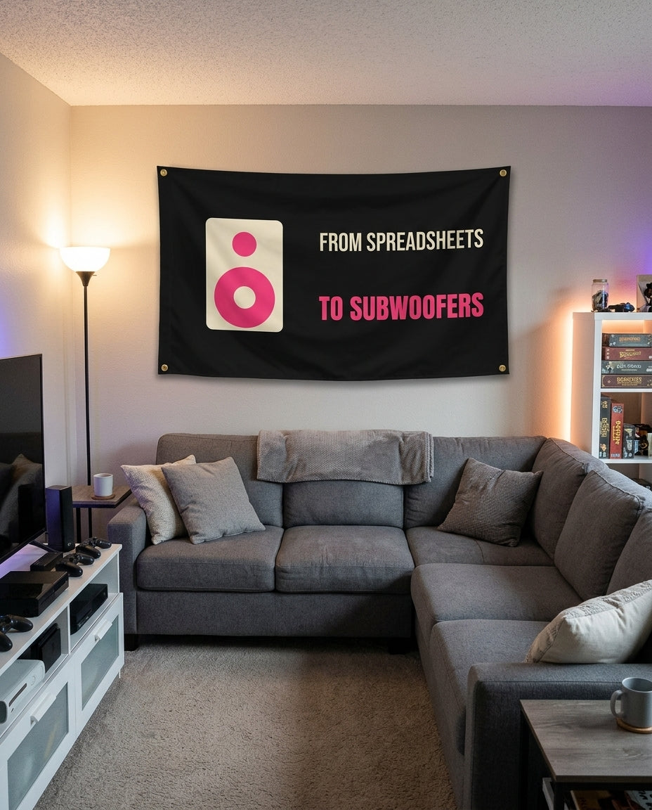 From Spreadsheets To Subwoofers flag decorating a game room wall