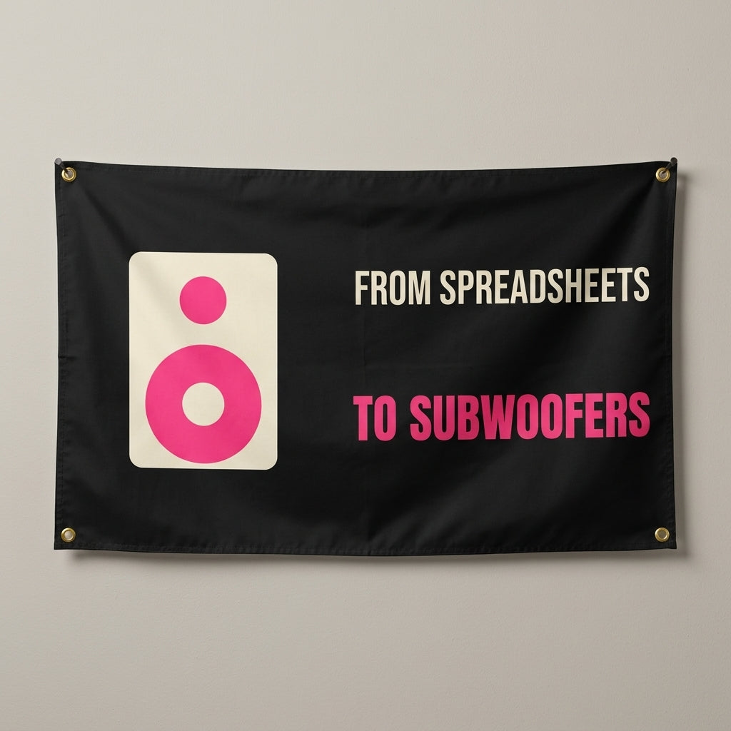 From Spreadsheets To Subwoofers flag 3x5 in black with a speaker, hung on a wall