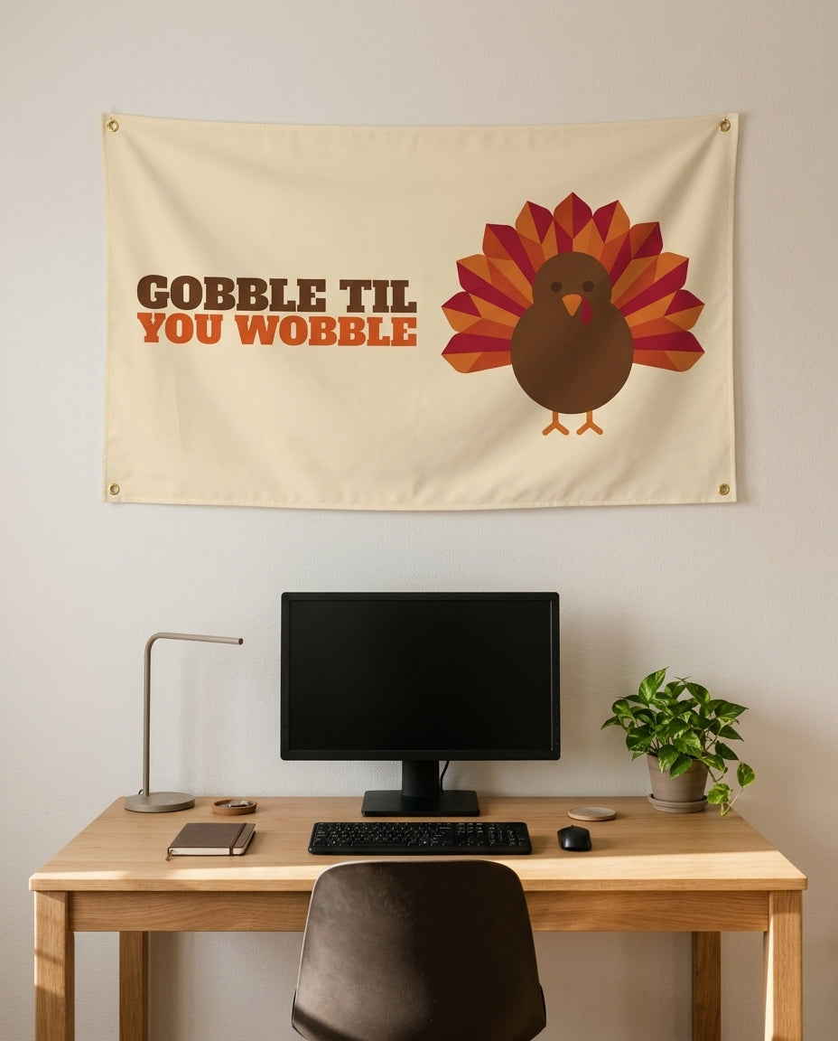 Gobble Til You Wobble 3x5 flag on a home office wall