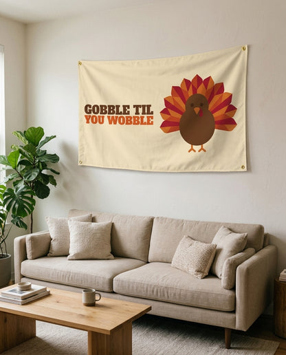 Gobble Til You Wobble flag used as living room wall decor