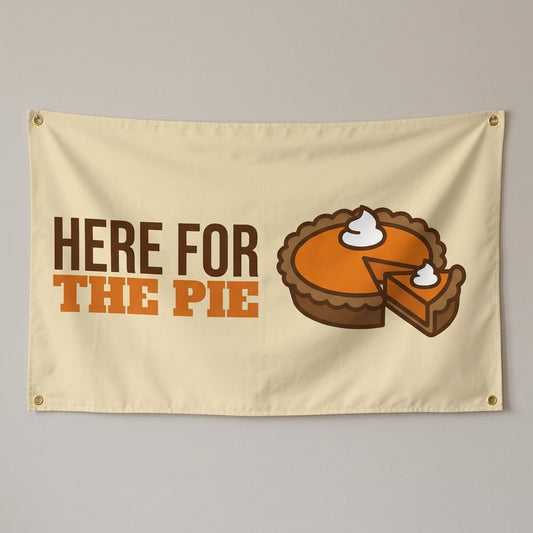 Here For The Pie flag 3x5 in cream with a pumpkin pie, hung on a wall