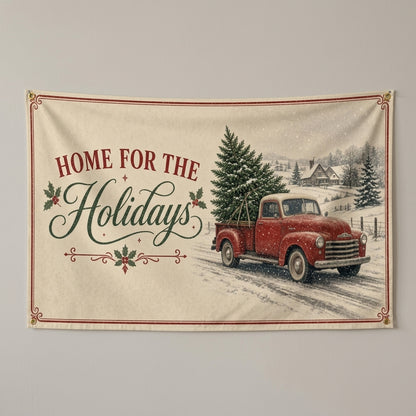 Home For The Holidays flag 3x5 with a red truck hauling a tree through the snow, hung on a wall
