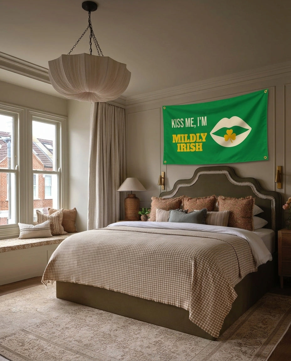 Kiss Me Im Mildly Irish St. Patrick's Day wall flag hanging in a bedroom