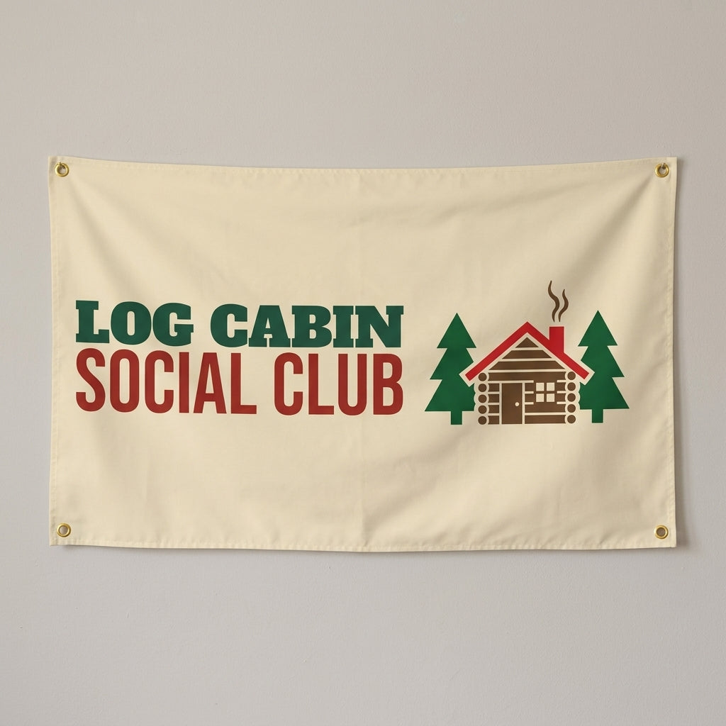 Log Cabin Social Club flag 3x5 in cream with a log cabin between pine trees, hung on a wall