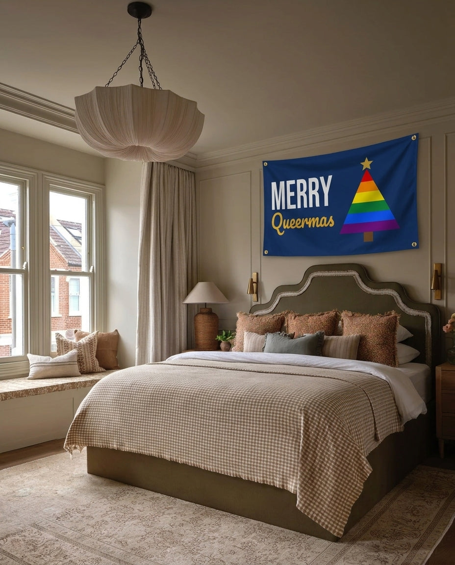 Merry Queermas pride Christmas wall flag hanging in a bedroom