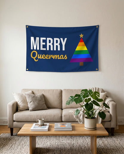 Merry Queermas flag used as living room wall decor