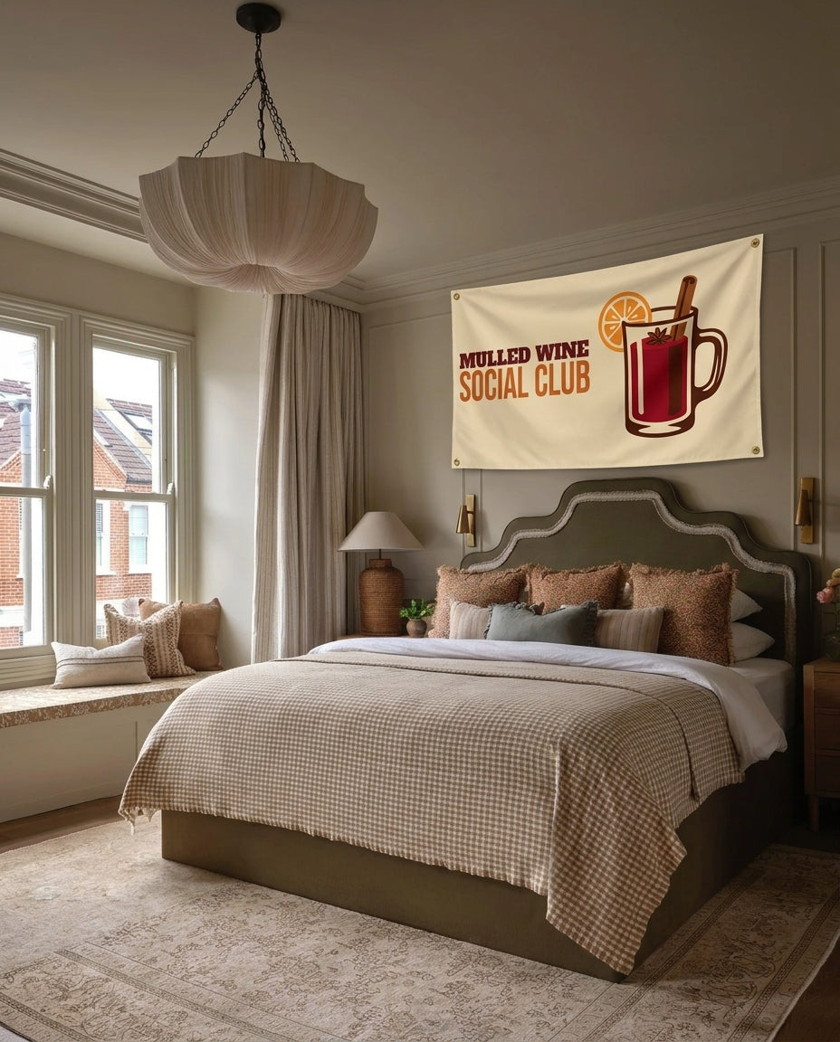 Mulled Wine Social Club winter wall flag hanging in a bedroom