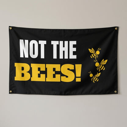 Bee Panic flag 3x5 in black with cartoon bees, hung on a wall