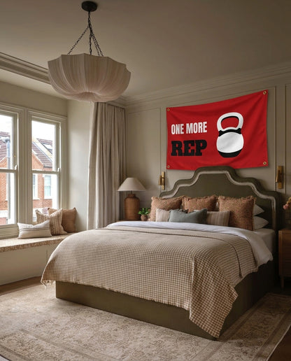 One More Rep gym wall flag hanging in a bedroom